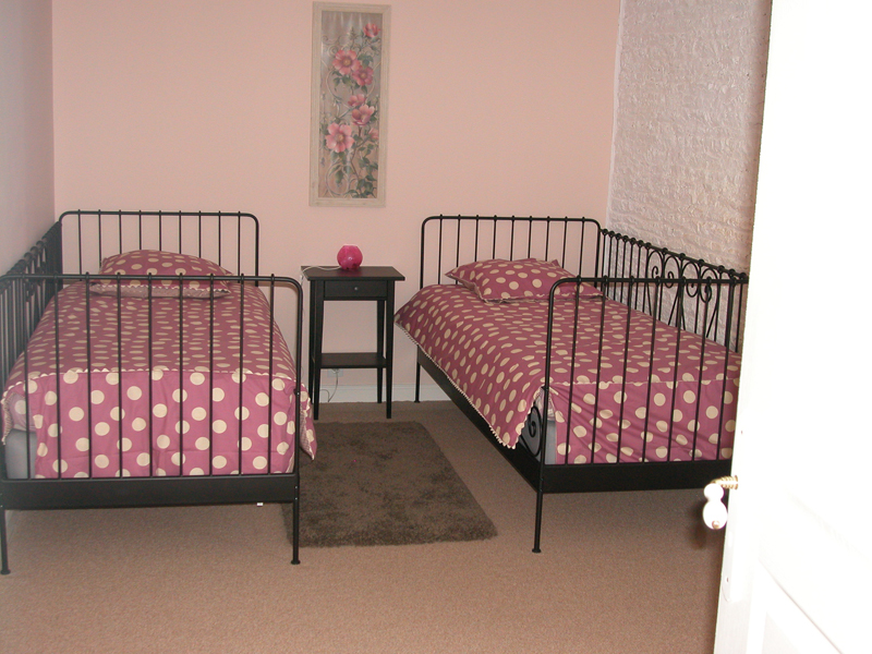 locsaisonniere-manoirdelaize-grange-chambre.jpg
